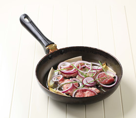 Pan frying pork and onion