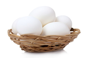 eggs in basket isolated on white