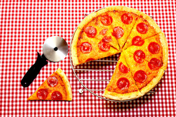 Whole Pepperoni Pizza and Cutter