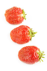 Three strawberries on a white background