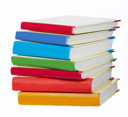 Pile of books with bright covers on white background