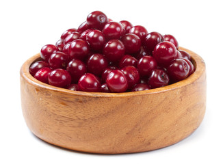 Bowl with ripe cherries. Isolated on a white background.