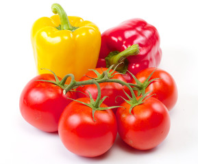 Fresh sweet pepper, tomato. On a white background.
