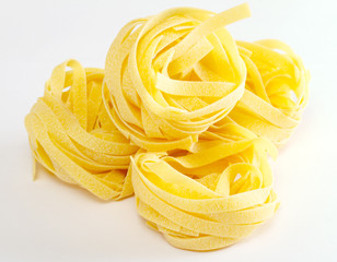 dried italian pasta on white background