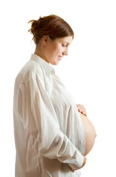 pregnant woman in white shirt over white