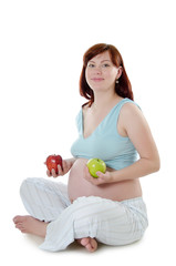 The pregnant woman with an apple