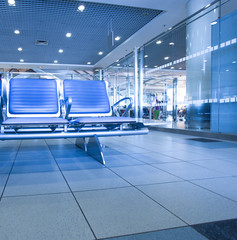 contemporary blue lounge with seats in the airport