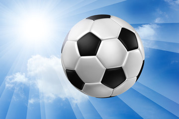 Football against blue sky