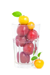 Fresh plums in glass