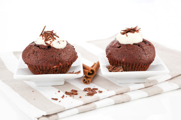 Two delicious chocolate muffins.