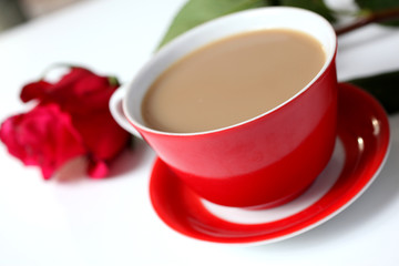 Cup of coffee and flowers on a white background