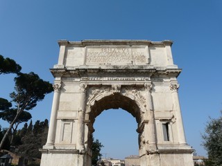Fototapeta na wymiar Arch of Titus at the Roman Forum in Rome, Italy
