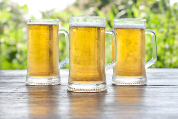 three mug of beer