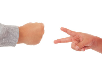 two children playing rock paper scissors