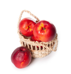 peaches on a white background in the basket