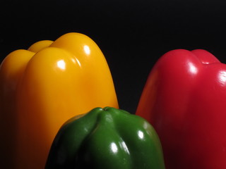 three different colored peppers