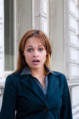 surprised young woman in the streets