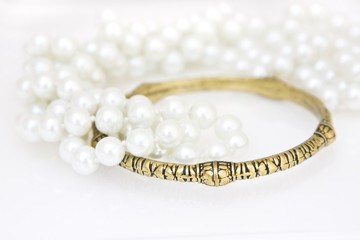 Brass bracelet and imitation pearls