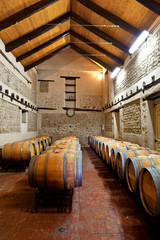 Wine barrels in an aging cellar of Ribera del Duero, Spain
