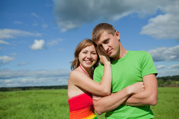 Obraz premium girl and boy together looking at camera and laughing