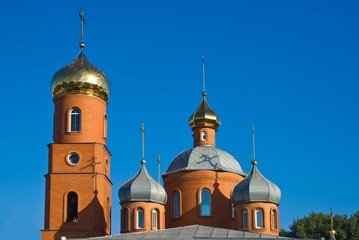 Fototapeta na wymiar beautiful christian church on a blue sky background