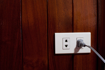 power plug on wood backgrounds
