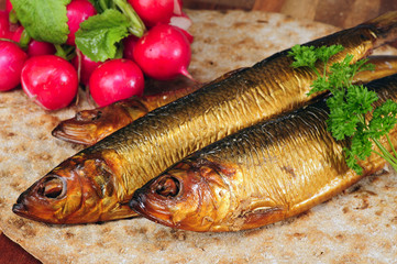 Smoked herring on crispbread with radishes and parsley.