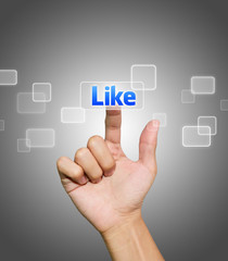 Hand pressing Like button