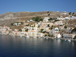Simi town houses and Mediterranean sea a Greek holiday island	