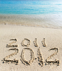 On sand at ocean edge it is written 