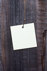 White sticker on a wooden background