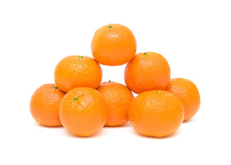 Ripe mandarins closeup, isolated on a white background