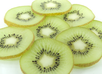 Kiwi slices closeup, background and texture.