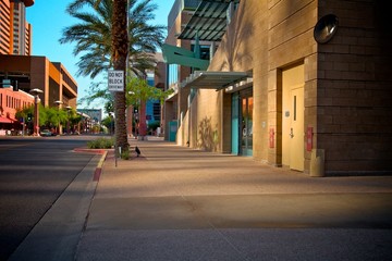 Fototapeta premium Downtown Sidewalk with Reflective Light