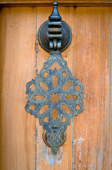 The door handle in the Oriental style. Toning. Vignetting.