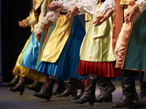 Low section of dancers wearing traditional clothing, Poland