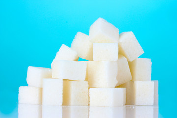 refined sugar on blue background