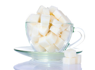 refined sugar in glass cup isolated on white