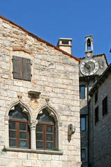 Venetian windows on the old palace with the clock tower