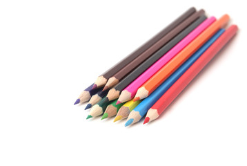 Many color pencils on a white background