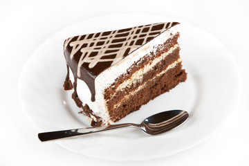 A piece of cake on white plate