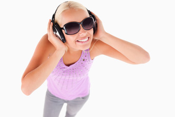 Cute lady with sunglasses and earphones