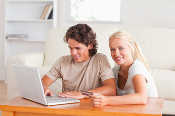 Happy couple with a laptop