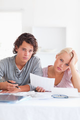 Fototapeta premium Unhappy couple reading a letter