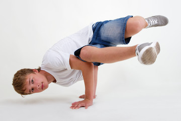 Teen b-boy standing in freeze on white