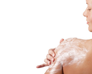 Woman applying moisturizer cream on her body