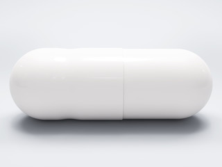 White medical pill on white background