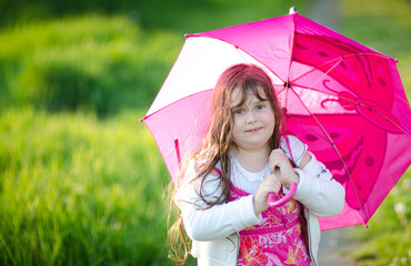 Happy smiling child with umbrella
