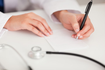 Doctor writing a note