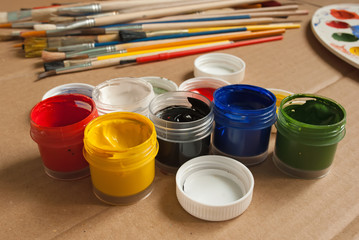 Open containers of paint in the workplace.
